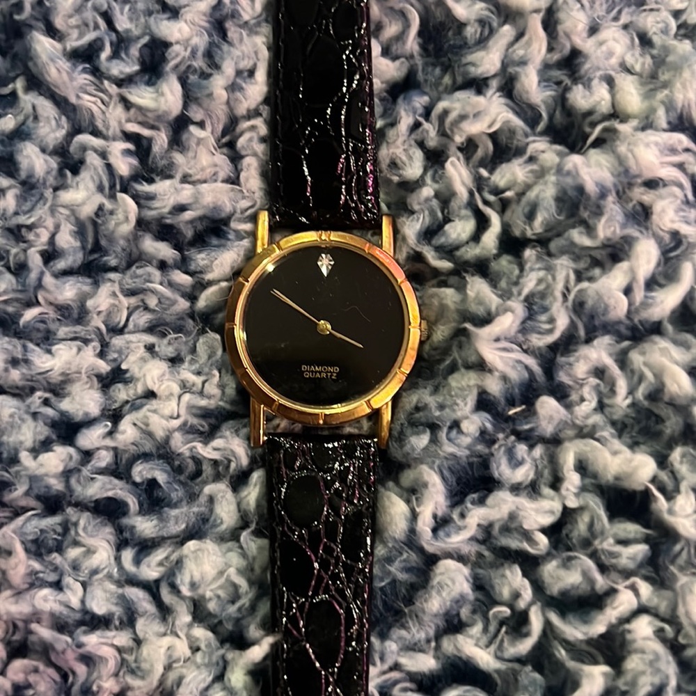black leather banded watch with diamond and quartz face (batteries not included)